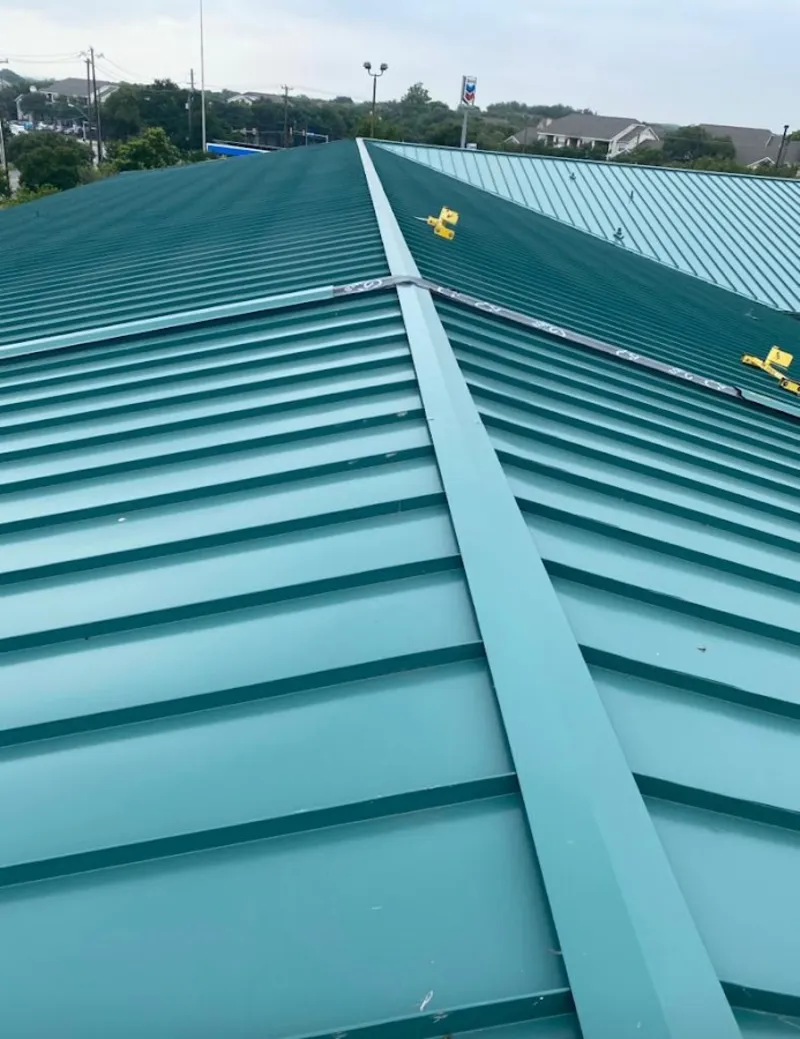 Green commercial metal roof ridge and valley for Metal Roof Repair in Poplar Grove